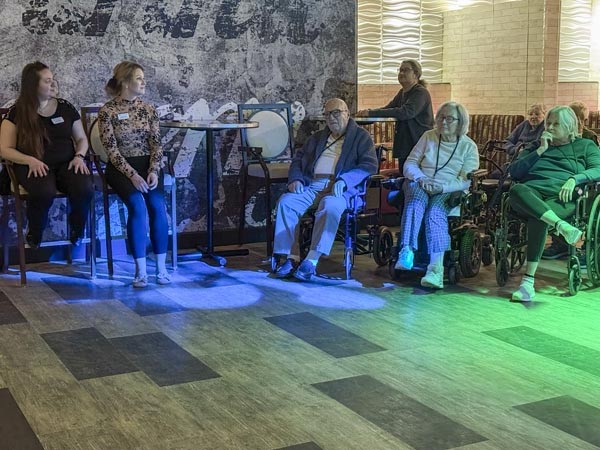 Adult group watching a show at the Luxury Senior Living in Clinton, NJ